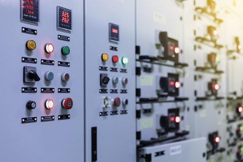 Specialist Engineering Recruitment. Man using controls and automation systems.