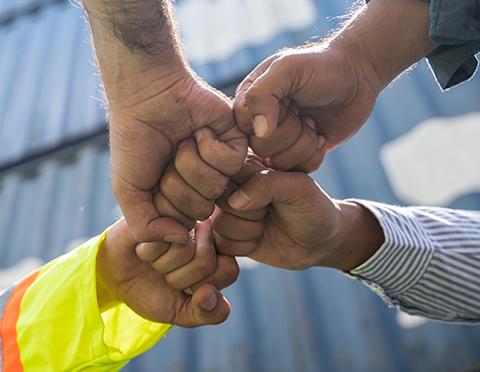 Specialist engineering recruitment in controls and automation. Engineers fist bump.